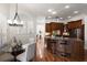 Spacious kitchen with wood cabinets, granite counters, stainless appliances, and breakfast bar at 11910 Keating Dr, Tampa, FL 33626