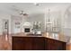 Gourmet kitchen island featuring wooden cabinets, stone countertops, and modern appliances at 11910 Keating Dr, Tampa, FL 33626