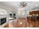 Open concept living room featuring a fireplace and island kitchen at 11910 Keating Dr, Tampa, FL 33626