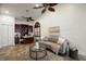 Relaxing living room featuring a built-in desk area, comfortable seating, and natural light at 11910 Keating Dr, Tampa, FL 33626