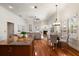 Open-concept living space with hardwood floors, a fireplace, and views to the backyard at 11910 Keating Dr, Tampa, FL 33626