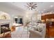 Bright living room with fireplace, sliding glass doors to patio, and open view to the kitchen at 11910 Keating Dr, Tampa, FL 33626