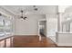 Spacious living room with hardwood floors, double doors to the lanai, and decorative columns at 11910 Keating Dr, Tampa, FL 33626