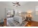 Light and airy main bedroom boasts French doors to the pool at 11910 Keating Dr, Tampa, FL 33626
