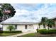 Well-maintained community building with a welcoming entrance and manicured landscaping at 12400 Park Blvd # 522, Seminole, FL 33772