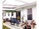 Exterior patio area with seating and lush potted plants at 12400 Park Blvd # 522, Seminole, FL 33772