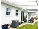 Exterior patio area with seating and sliding door at 12400 Park Blvd # 522, Seminole, FL 33772