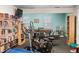 Community recreation room featuring exercise equipment, bookshelves, and a pool table at 12400 Park Blvd # 522, Seminole, FL 33772