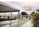 Community shuffleboard courts lined with palm trees and well-maintained landscaping at 12400 Park Blvd # 522, Seminole, FL 33772
