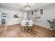 Cozy dining area with a round table, modern lighting, and stylish decor, perfect for intimate meals at 129 Cypress Ct, Oldsmar, FL 34677