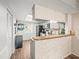 Compact kitchen featuring essential appliances, countertop space, and a functional layout for efficient cooking at 129 Cypress Ct, Oldsmar, FL 34677