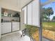 Convenient laundry room with modern washer and dryer, plus added storage at 129 Cypress Ct, Oldsmar, FL 34677