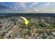 An aerial view shows a property in a suburb with multiple retention ponds at 14073 Jennifer Ter, Largo, FL 33774