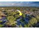 Aerial view of a charming neighborhood, showcasing the beautiful homes and tree-lined streets near the calming ocean horizon at 14073 Jennifer Ter, Largo, FL 33774