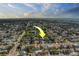 An aerial view showcases a property in a location with many retention ponds and views of the ocean at 14073 Jennifer Ter, Largo, FL 33774