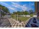 Beautiful backyard enhanced with a tiled patio, decorative plants, and a well-maintained lawn at 14073 Jennifer Ter, Largo, FL 33774