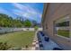 Manicured backyard showing a neatly kept lawn and a tiled walkway lined with decorative plants at 14073 Jennifer Ter, Largo, FL 33774