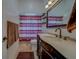 Bathroom with single vanity, shower-tub combo, and bronze fixtures at 14073 Jennifer Ter, Largo, FL 33774