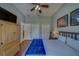Bedroom featuring hardwood floors, ceiling fan and multiple closets at 14073 Jennifer Ter, Largo, FL 33774