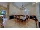 Formal dining room featuring a large square table and seating for fourteen with a large window at 14073 Jennifer Ter, Largo, FL 33774