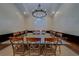 Spacious dining room features a large table with seating for fourteen, perfect for hosting dinner parties at 14073 Jennifer Ter, Largo, FL 33774