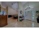 Bright, open foyer featuring elegant lighting, high ceilings, and beautiful flooring at 14073 Jennifer Ter, Largo, FL 33774