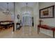 Bright, open foyer featuring elegant lighting, high ceilings, and beautiful flooring at 14073 Jennifer Ter, Largo, FL 33774