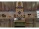 Gourmet kitchen with stainless steel appliances and a cooktop with tile backsplash at 14073 Jennifer Ter, Largo, FL 33774