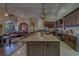 Spacious kitchen featuring an oversized island, stainless steel appliances, and custom cabinetry at 14073 Jennifer Ter, Largo, FL 33774