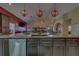 Expansive kitchen featuring a large island with seating and stainless steel dishwasher at 14073 Jennifer Ter, Largo, FL 33774