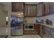 Modern kitchen boasts stainless steel refrigerator and matching appliances with ample storage at 14073 Jennifer Ter, Largo, FL 33774