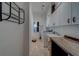 Bright laundry room features white cabinets, washer, dryer and wash basin at 14073 Jennifer Ter, Largo, FL 33774