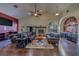Spacious living room with high ceilings, fireplace, wet bar, and rich wood floors at 14073 Jennifer Ter, Largo, FL 33774