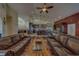 Living room with an open floor plan to kitchen and dining area and vaulted ceilings at 14073 Jennifer Ter, Largo, FL 33774
