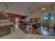 Open-concept living room with hardwood floors, fireplace, soaring ceilings, and ample natural light at 14073 Jennifer Ter, Largo, FL 33774