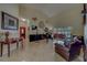 Open living area with high ceilings, a grand piano, and access to the outdoor pool area at 14073 Jennifer Ter, Largo, FL 33774