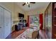 Bright home office with modern desk, hardwood floors, natural light, and seating for two at 14073 Jennifer Ter, Largo, FL 33774
