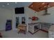 An outdoor kitchen comes complete with a microwave, stainless steel grill, and a Pac-Personal arcade game at 14073 Jennifer Ter, Largo, FL 33774