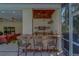 An outdoor bar area allows for seating at the stone counter with beautiful plants at 14073 Jennifer Ter, Largo, FL 33774