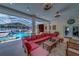 A large outdoor living space with access to a pool with hot tub and kitchen area at 14073 Jennifer Ter, Largo, FL 33774