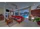 A spacious living area leads out to a screened in pool, outdoor kitchen and arcade game at 14073 Jennifer Ter, Largo, FL 33774