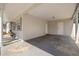 Carport with access doors to the home and a view to the exterior with a bench at 14917 Philmore Rd, Tampa, FL 33613