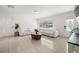 Inviting living room boasts a neutral color palette, tile floors, a comfortable sofa, and an abundance of natural light at 14917 Philmore Rd, Tampa, FL 33613