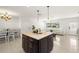 Open layout features a center island, dining area, and an inviting living room with comfortable seating at 14917 Philmore Rd, Tampa, FL 33613