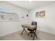 Home office featuring a window, wooden desk and a black leather chair at 14917 Philmore Rd, Tampa, FL 33613