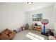 Spacious playroom filled with toys, natural light, and tile floors, perfect for Gathering fun at 14917 Philmore Rd, Tampa, FL 33613