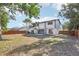 Spacious backyard with lush trees, providing shade and a serene backdrop to the property's outdoor space at 1502 Creekbend Dr, Brandon, FL 33510
