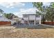 Expansive backyard featuring a well-manicured lawn, complemented by a charming patio area and privacy fence at 1502 Creekbend Dr, Brandon, FL 33510