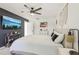 Cozy bedroom showcasing a mounted TV, ceiling fan, and serene decor for a relaxing ambiance at 1502 Creekbend Dr, Brandon, FL 33510