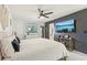 Stylish bedroom features plank accent wall with TV, large window, and access to en suite bathroom at 1502 Creekbend Dr, Brandon, FL 33510